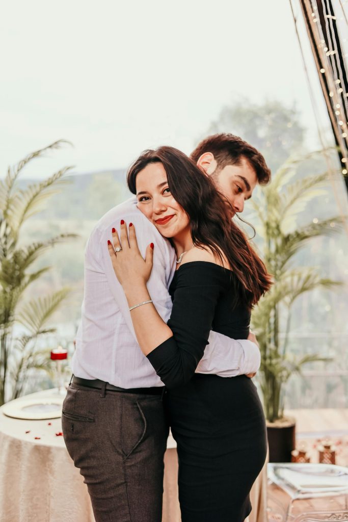 A couple embracing and smiling